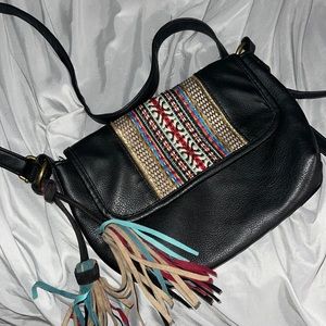 Cute little leather black boho purse with tassels and bottom closure super cute